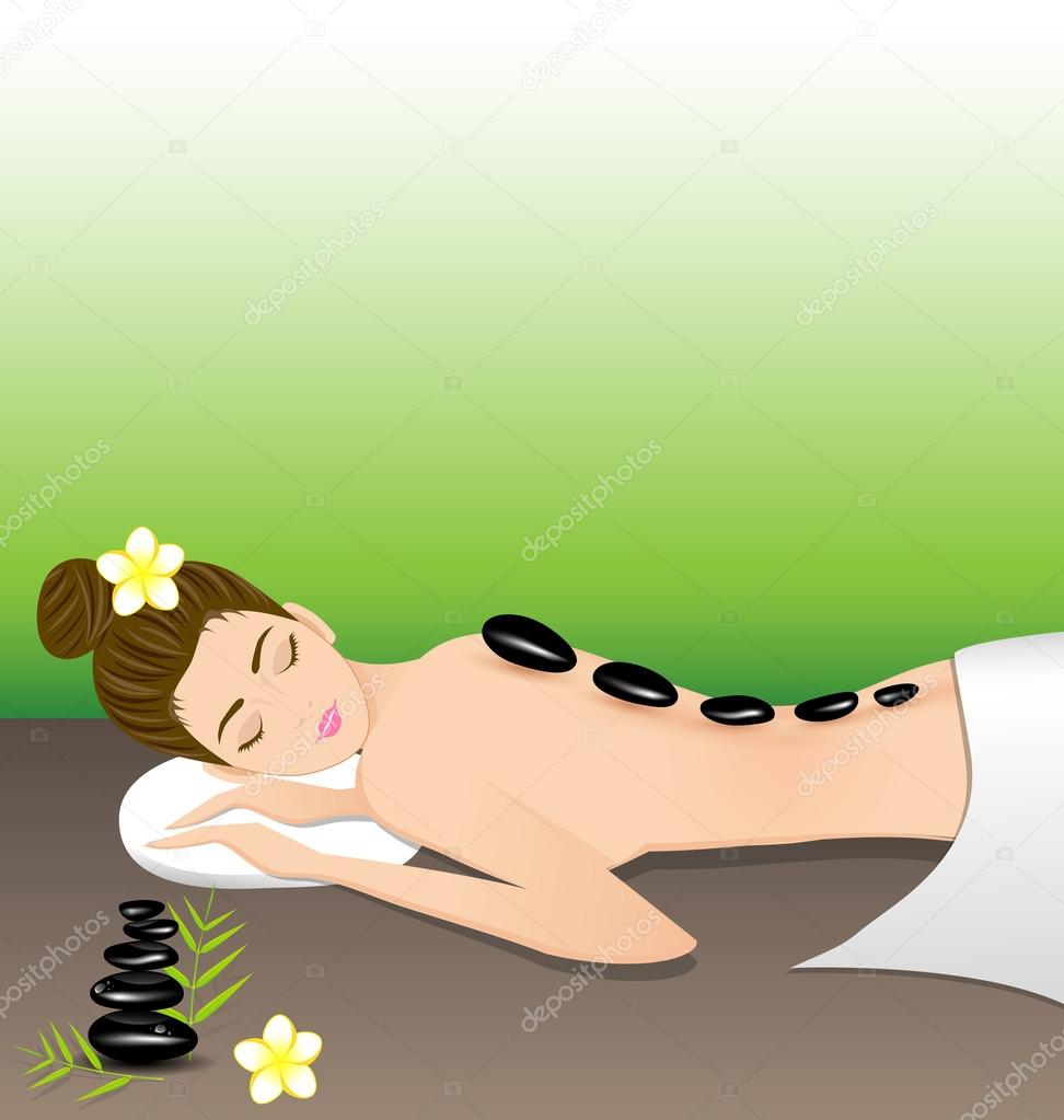 Beautiful woman lying a therapy with hot stones in spa 