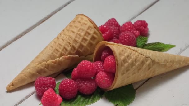 4K. Cone waffle with fresh raspberry rotation on a white wooden table. — Stock Video