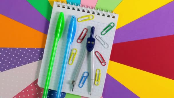 School office supplies on Colorful paper background. 360 degree rotation — Stock Video