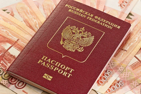 Russian passport on the background of the Russian money — Stock Photo, Image