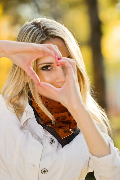 Young girl clasped her hands in front of face — Stock Photo, Image