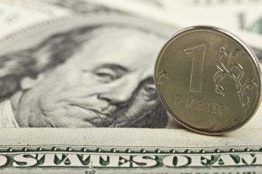 Russian ruble against the background of the Iron dollars clipart