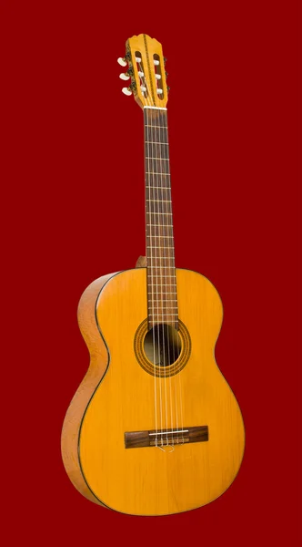 赤い背景の上のギター — ストック写真