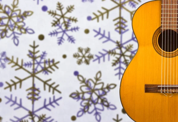 Classical guitar on the background of snowflakes — Stock Photo, Image