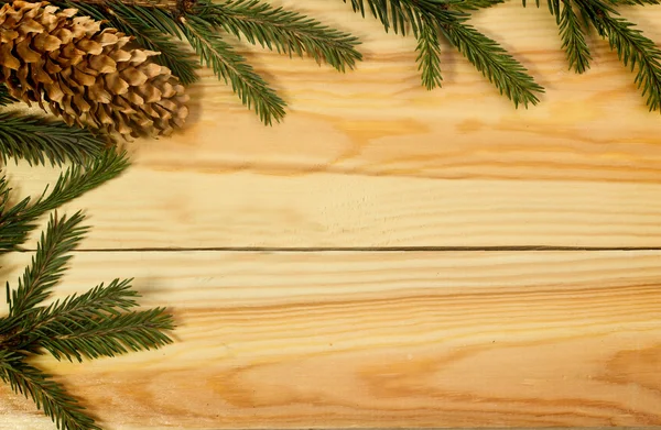 Christmas tree on wooden background — Stock Photo, Image