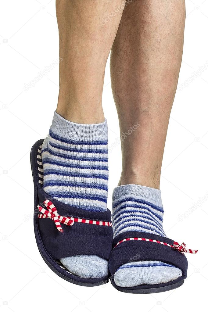 Male legs in women's slippers