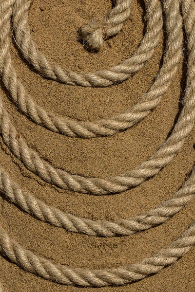 The rope on the sea sand — Stock Photo, Image