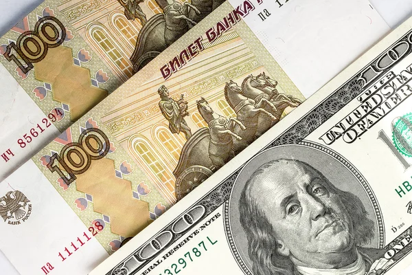 Russian rubles and US dollars as background — Stock Photo, Image