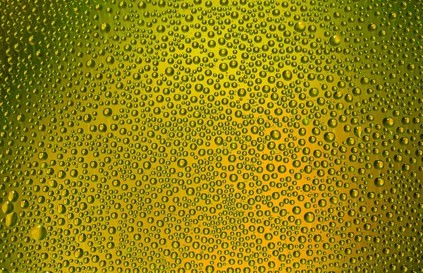 Yellow drops on the glass — Stock Photo, Image