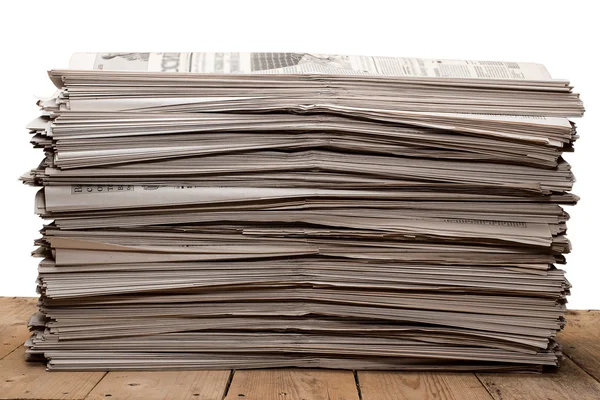 A stack of old newspapers on white background — Stock Photo, Image