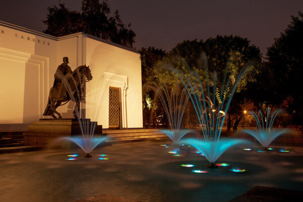 Beautiful colorful fountain at night in Park of the Reserve, Lima, Peru