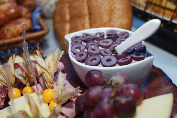 Olive sauce in the middle of catering table — Stock Photo, Image