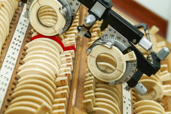 Optician with set of trial frames and trial lenses — Stock Photo, Image