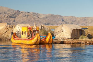 Reed boat on Island of Uros lake Titicaca Peruand Bolivia. clipart