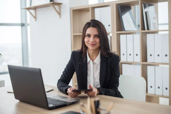 stock image business woman with notebook in office, workplace