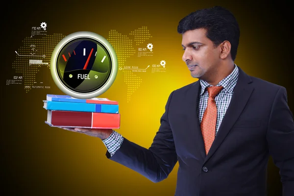 Businessman holds speedometer icon — Stock Photo, Image