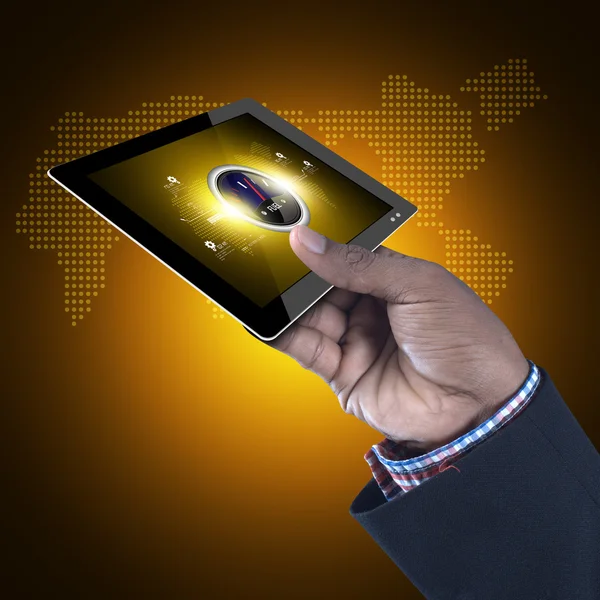 Hand holds digital tablet with speedometer icon — Stock Photo, Image