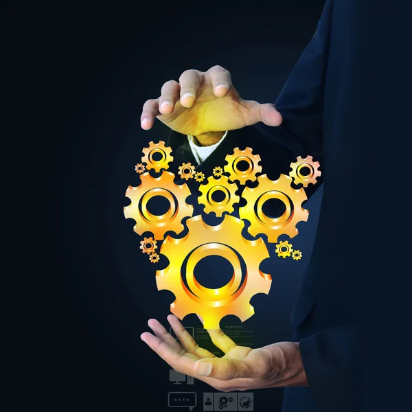 Businessman showing gears cogs — Stock Photo, Image