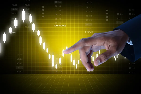 Businessman pointing on the stock chart — Stock Photo, Image