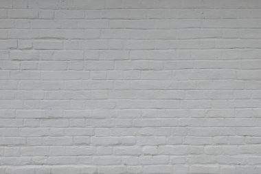 Old brick wall painted white photographed horizontally