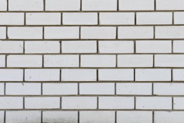 Havan topu lekeli beyaz silikat tuğladan yapılmış tuğla duvar.