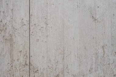 Açık griye boyanmış eski bir beton duvarın soyut arkaplanı