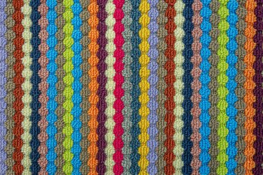 Çok renkli halı dokusunun soyut arkaplanı kapat