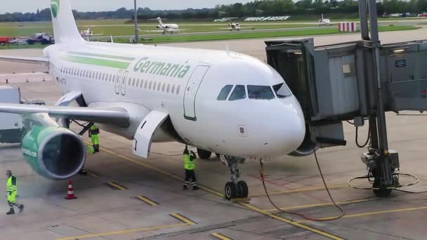 Airport Window Germania Airlines Airplane Docks Passenger Boarding Bridge — Stock Video