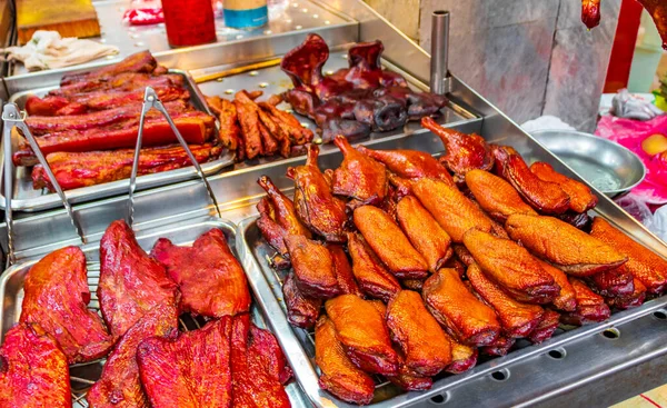 Selection of meat chicken pork face Thai food and Chinese cuisine in street food old market in China Town Bangkok Thailand.