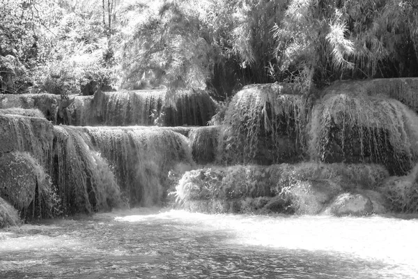 Black and white picture of the worlds most beautiful waterfalls Kuang Si waterfall in Luang Prabang Laos.
