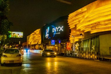 Nightlife and colorful lights at Onyx building in Bangkok Thailand. clipart