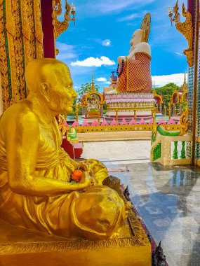 Colorful huge fat laughing Buddha and golden statues in Wat Plai Laem temple on Koh Samui island Surat Thani Thailand