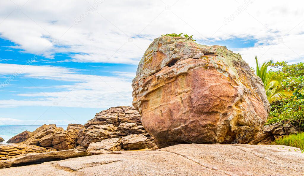 Huge rocks at amazing Praia de Lopes Mendes beach on the big tropical island Ilha Grande in Angra dos Reis Rio de Janeiro Brazil.