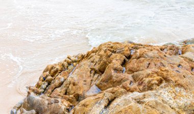 Amazing beach tropical landscape panorama view with turquoise blue water waves and rocks in Patong Beach Kathu District Phuket Island Province Southern Thailand in Southeast Asia.