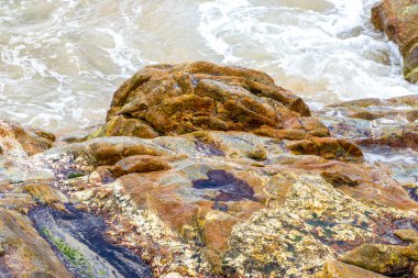 Amazing beach tropical landscape panorama view with turquoise blue water waves and rocks in Patong Beach Kathu District Phuket Island Province Southern Thailand in Southeast Asia.