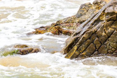 Amazing beach tropical landscape panorama view with turquoise blue water waves and rocks in Patong Beach Kathu District Phuket Island Province Southern Thailand in Southeast Asia.