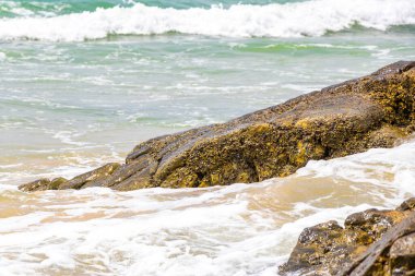 Amazing beach tropical landscape panorama view with turquoise blue water waves and rocks in Patong Beach Kathu District Phuket Island Province Southern Thailand in Southeast Asia.