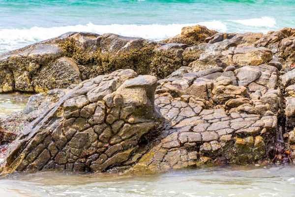 Amazing beach tropical landscape panorama view with turquoise blue water waves and rocks in Patong Beach Kathu District Phuket Island Province Southern Thailand in Southeast Asia.