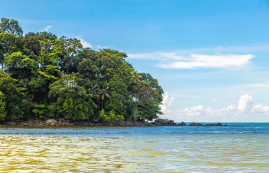 Amazing beach tropical landscape panorama view with turquoise blue water waves and rocks in Patong Beach Kathu District Phuket Island Province Southern Thailand in Southeast Asia.