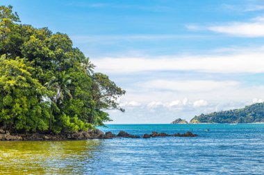 Amazing beach tropical landscape panorama view with turquoise blue water waves and rocks in Patong Beach Kathu District Phuket Island Province Southern Thailand in Southeast Asia.