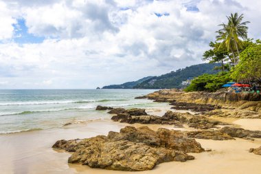 Amazing beach tropical landscape panorama view with turquoise blue water waves and rocks in Patong Beach Kathu District Phuket Island Province Southern Thailand in Southeast Asia.