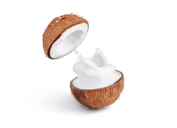 Kokosmilch Spritzer Aus Gespaltener Kokosnuss Auf Weißem Isoliertem Hintergrund Gefrierbewegung Stockfoto