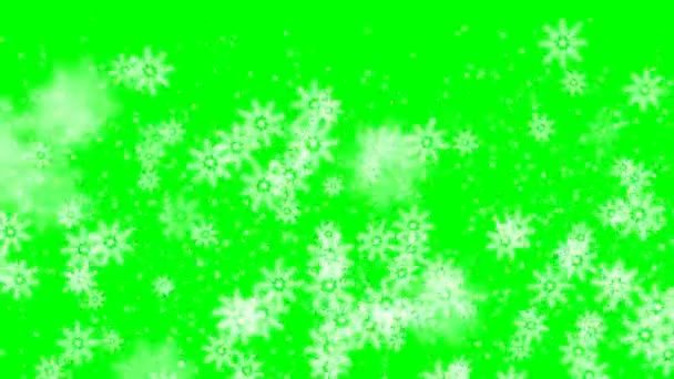 Xmas téli zöld háttér havazás hó Boldog Karácsonyi részecskék repülni lassított felvétel a levegőben