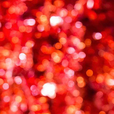 Kırmızı soyut bokeh ışıkları, parlayan odaklanmış arkaplan.