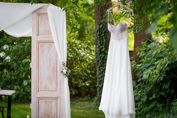 Hanging wedding dress in nature