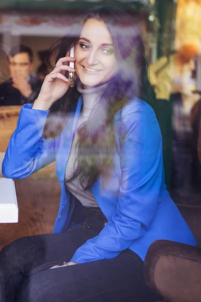 Brunette woman in business clothes: grey sweater and blue jacket — Stock Photo, Image