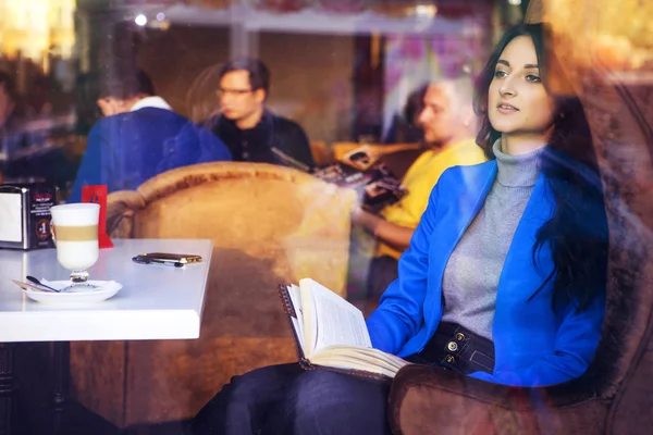 Brunette woman in business clothes: grey sweater and blue jacket — Stock Photo, Image