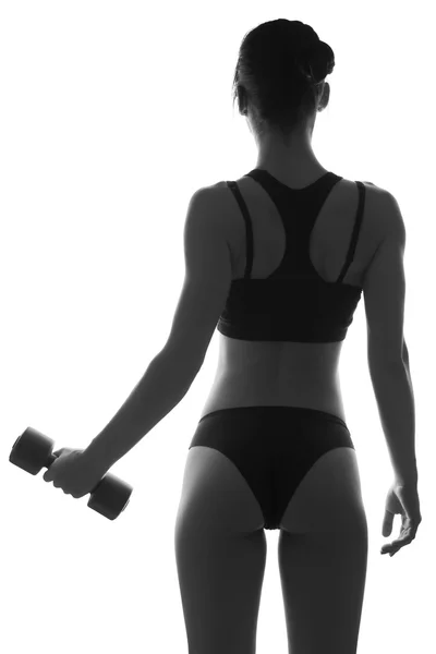 性感苗条健康的女人身体与哑铃。肌肉发达的背部。Sportswea — 图库照片