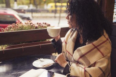 Beautifil brunette caucasian woman in leather jacket and plaid s
