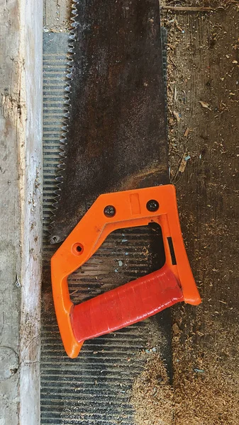 metal saw on wood background